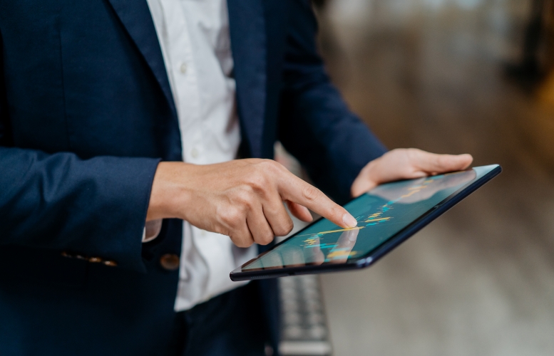 Man using tablet on the move for work