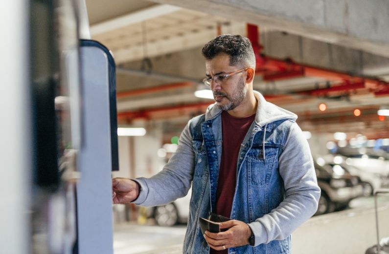 Man at self service kiosk